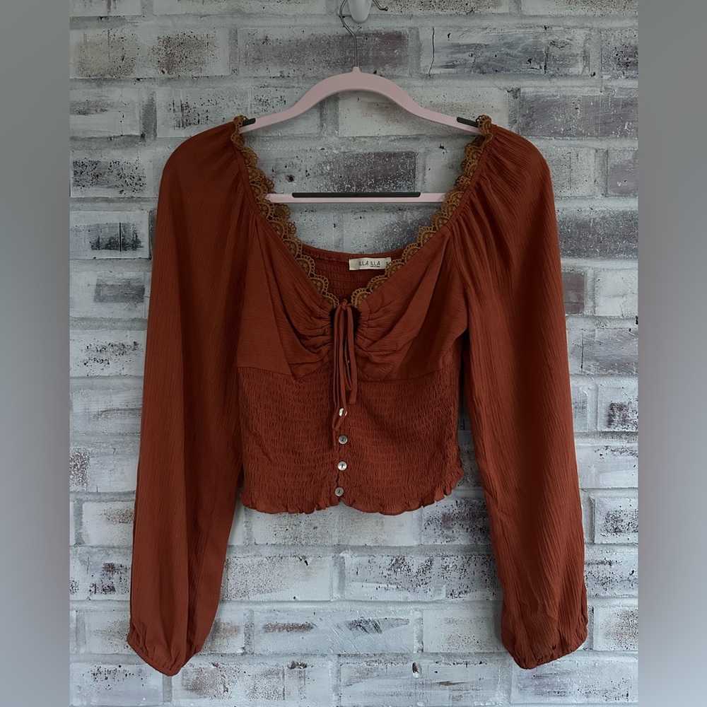 ILLA ILLA frontera tie long sleeve e shirt with lace details.